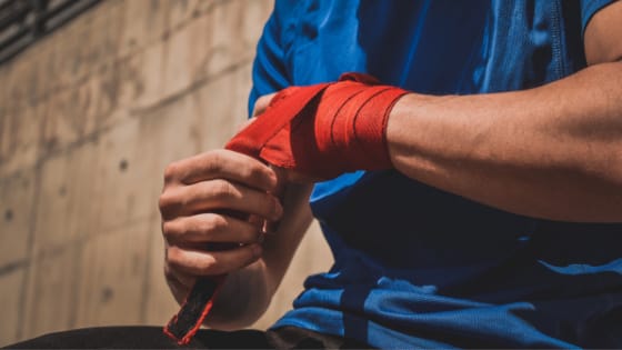 Athlete Wrapping Wrist for Maintenance Massage