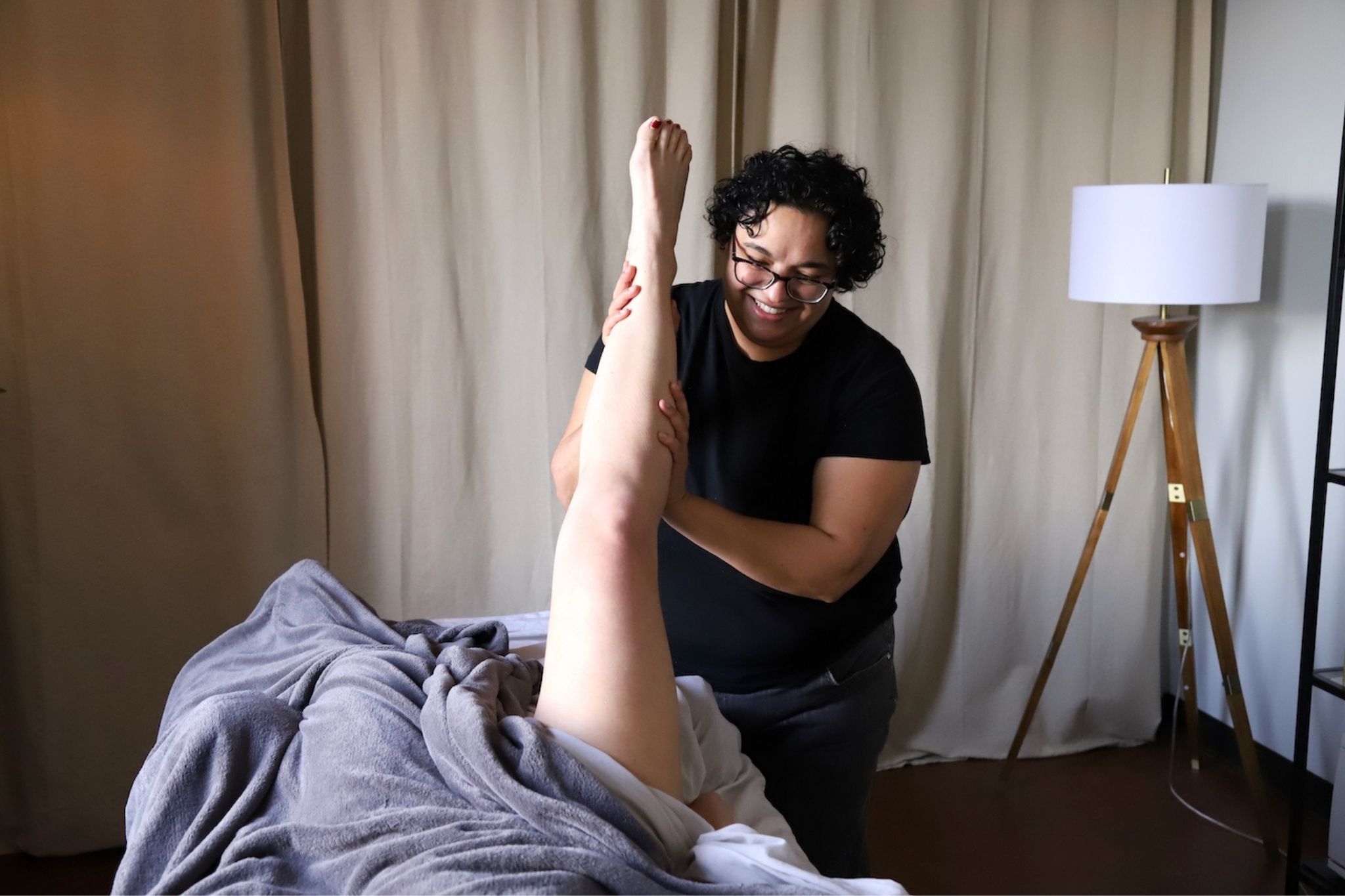 client having leg stretched during a sports massage