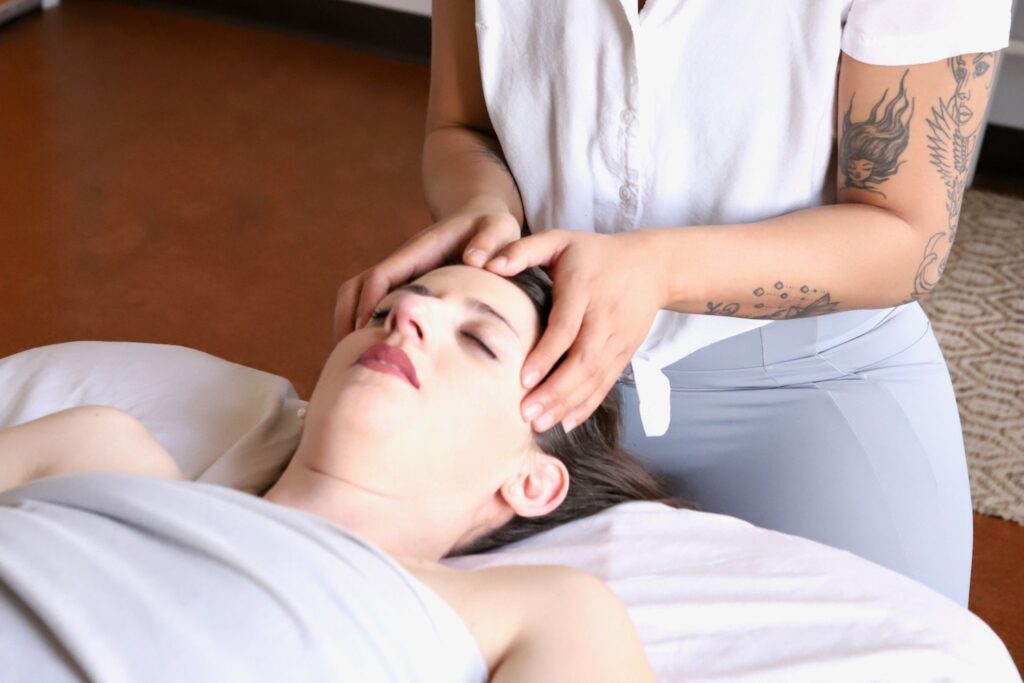 patient receiving a migraine relief therapy massage on head