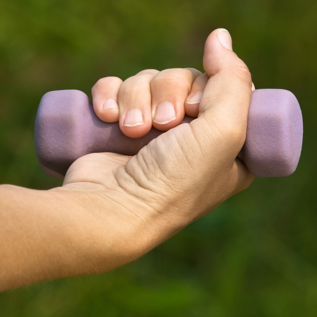 hand using light purple dumbbell wrist flexion