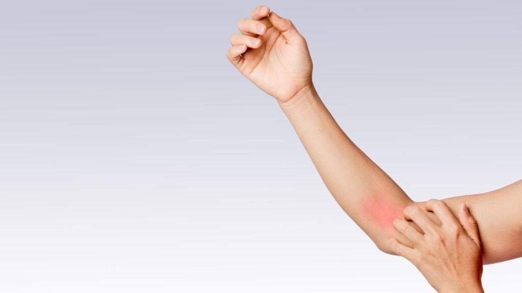 arm held up with pain in forearm highlighted in red