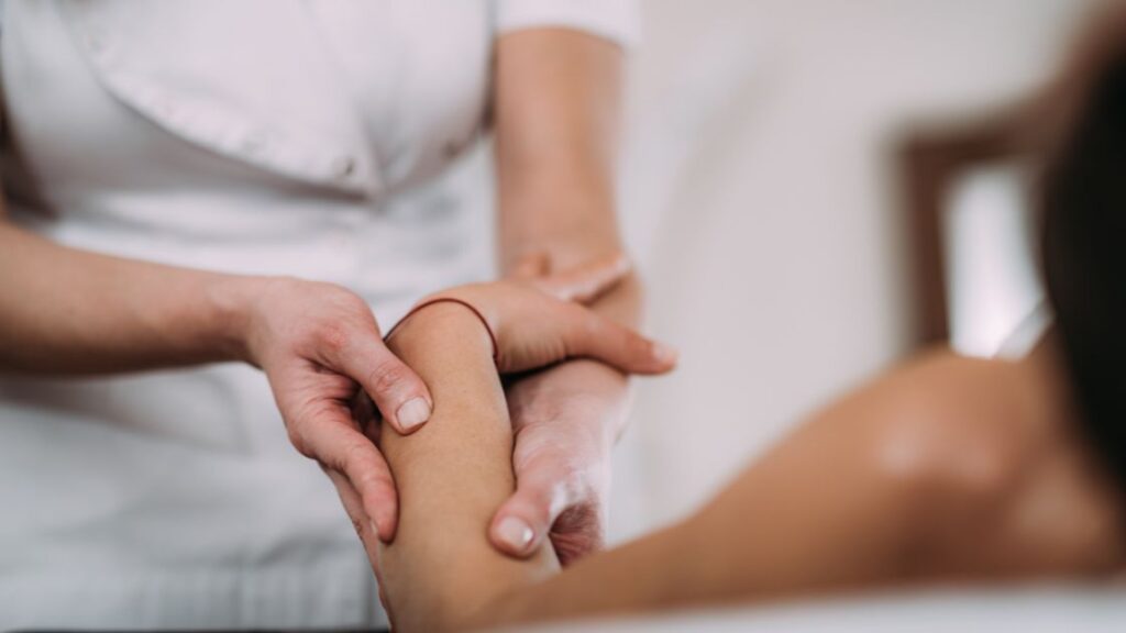 sports massage on patient's arm