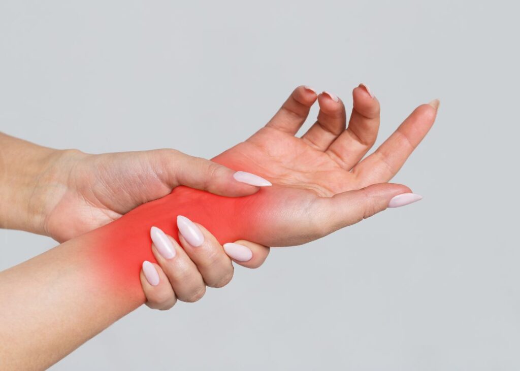 woman holding painful wrist
