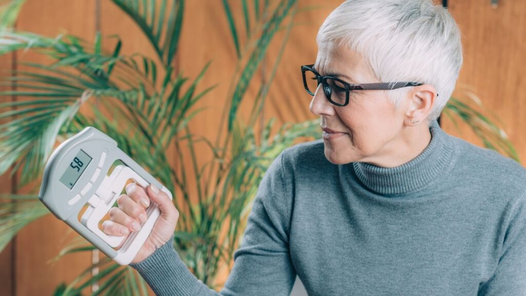 BH – Grip Strength older patient testing grip strength with dynamometer
