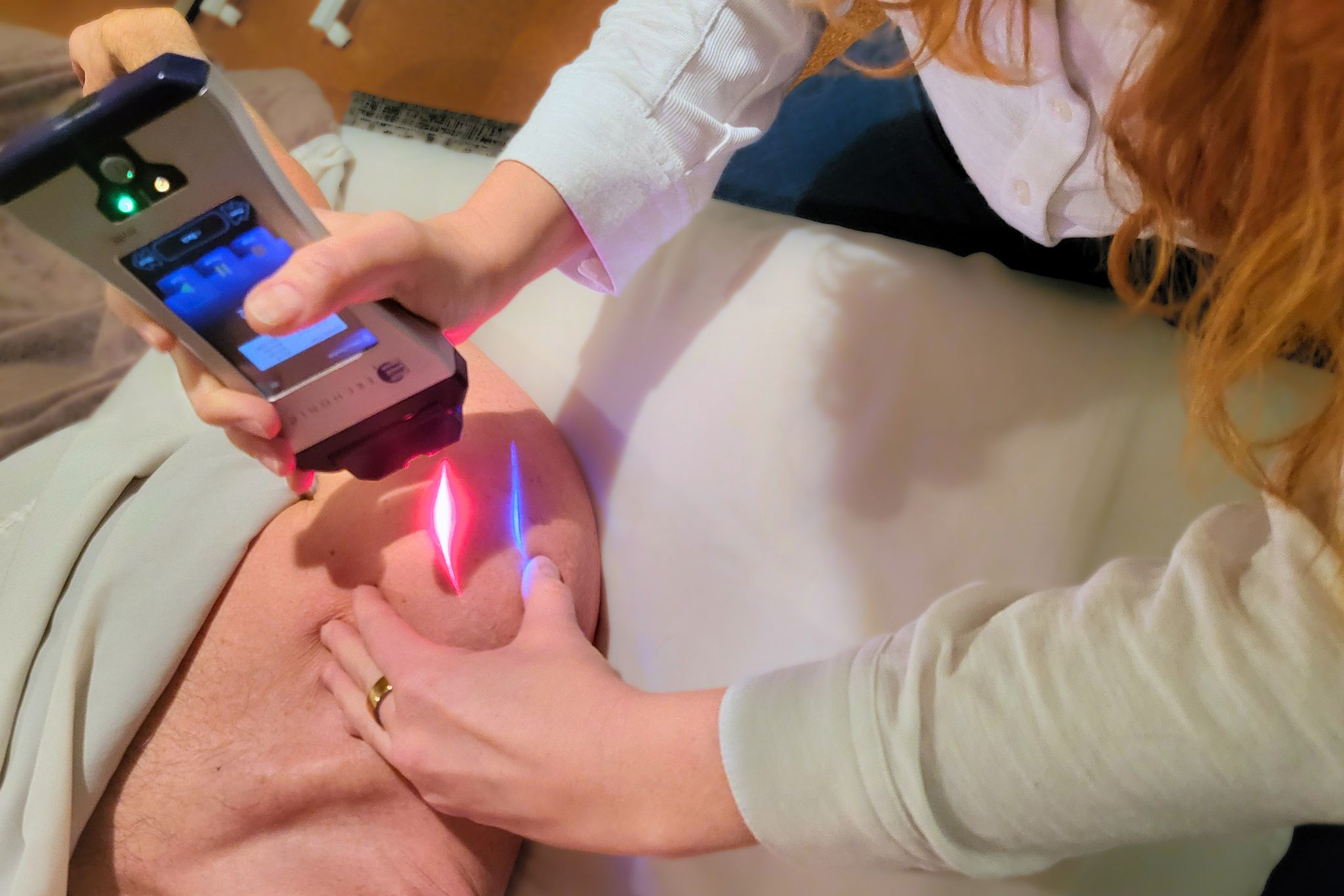 Cold Laser Cold Laser Therapy on patient's shoulder