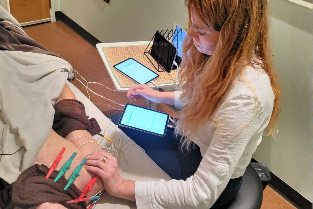 Microcurrent on patient's shoulder