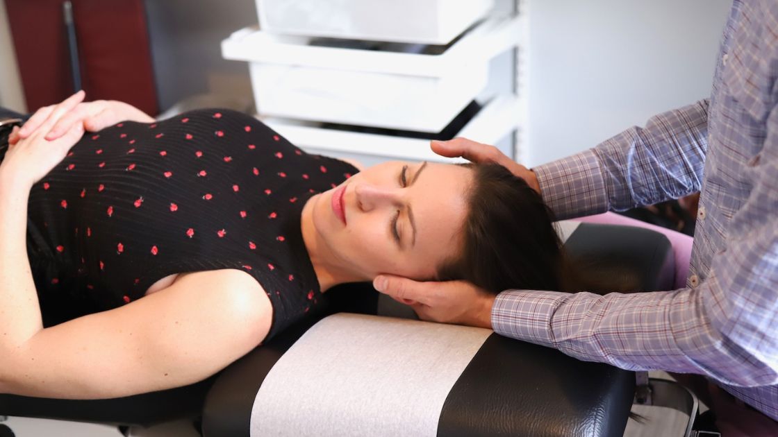 patient receiving a neck adjustment from Dr. Moyer, Chiropractor